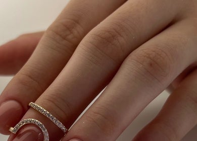 Elegant manicured hand with rings at DK Nail Aesthetician, Sutton, England, GB.