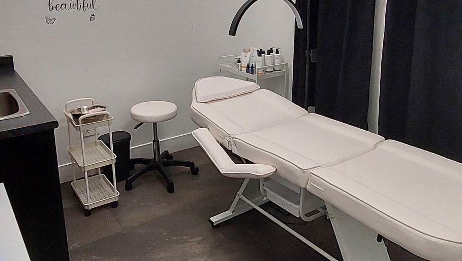 Cozy treatment room at Elena Danileiko Spa in Kelowna, British Columbia, CA with massage table and supplies.