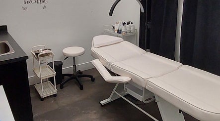 Cozy treatment room at Elena Danileiko Spa in Kelowna, British Columbia, CA with massage table and supplies.