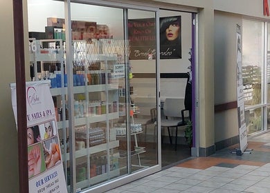Entrance of Elena Danileiko Spa in Kelowna, BC, showcasing beauty products and spa services.