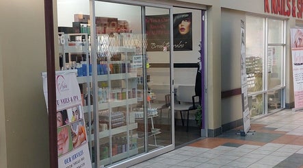 Entrance of Elena Danileiko Spa in Kelowna, BC, showcasing beauty products and spa services.