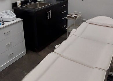 Massage room at Elena Danileiko Spa, Kelowna, British Columbia, CA with a treatment bed and sleek decor.