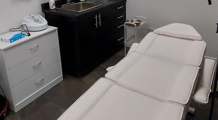 Massage room at Elena Danileiko Spa, Kelowna, British Columbia, CA with a treatment bed and sleek decor.