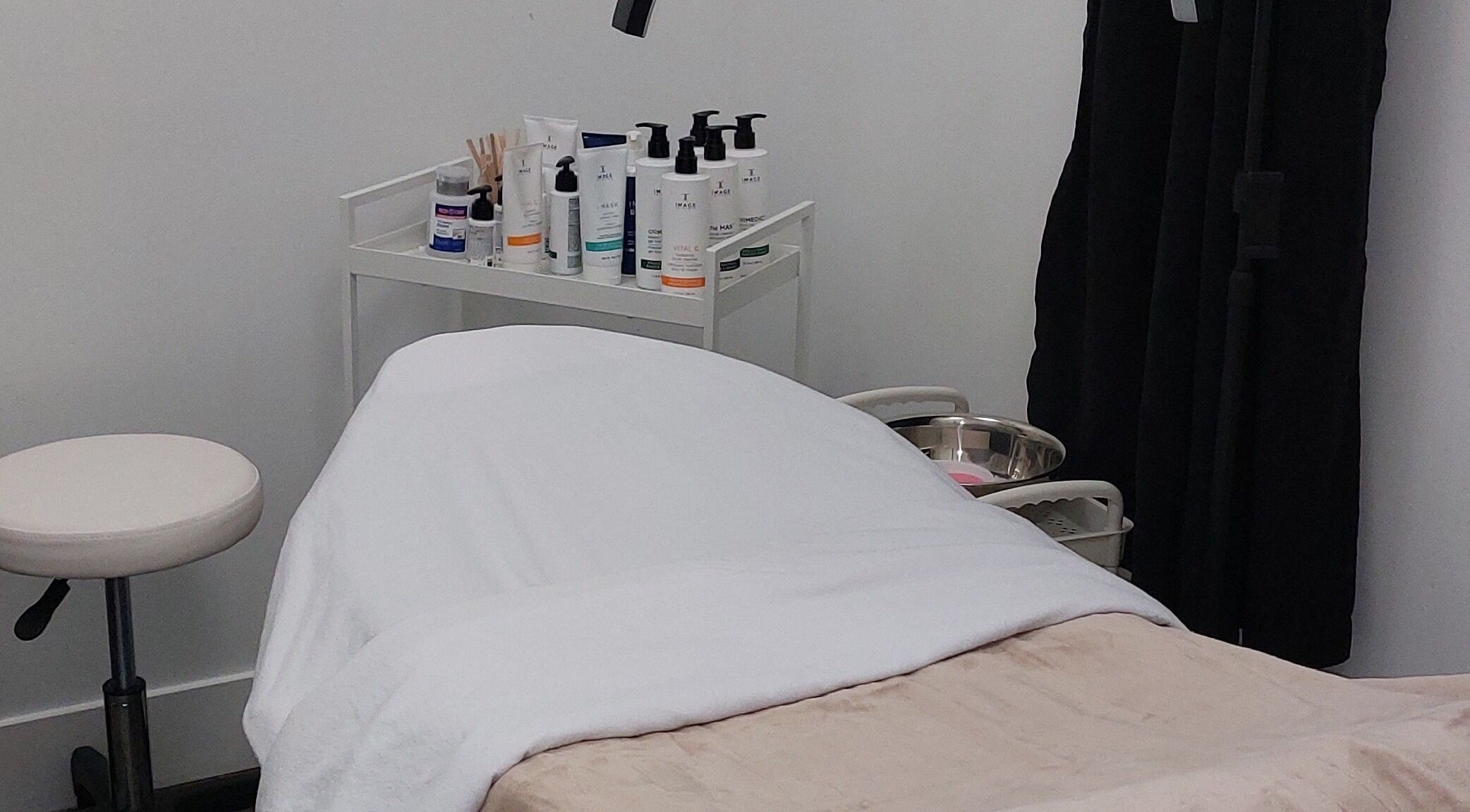 Cozy treatment room at Skincode Spa by Elena in Kelowna, British Columbia, CA, ready for a relaxing session.