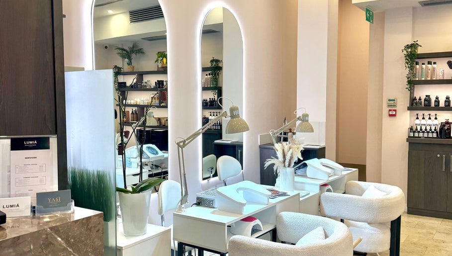 Elegant interior of LUMIÁ BEAUTY CHELSEA, London, England, GB, showcasing stylish manicure stations.