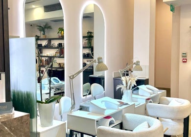 Elegant interior of LUMIÁ BEAUTY CHELSEA, London, England, GB, showcasing stylish manicure stations.