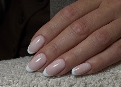 Elegant French manicure at LUMIÁ BEAUTY CHELSEA, London, England, GB, showcasing classic nail style.