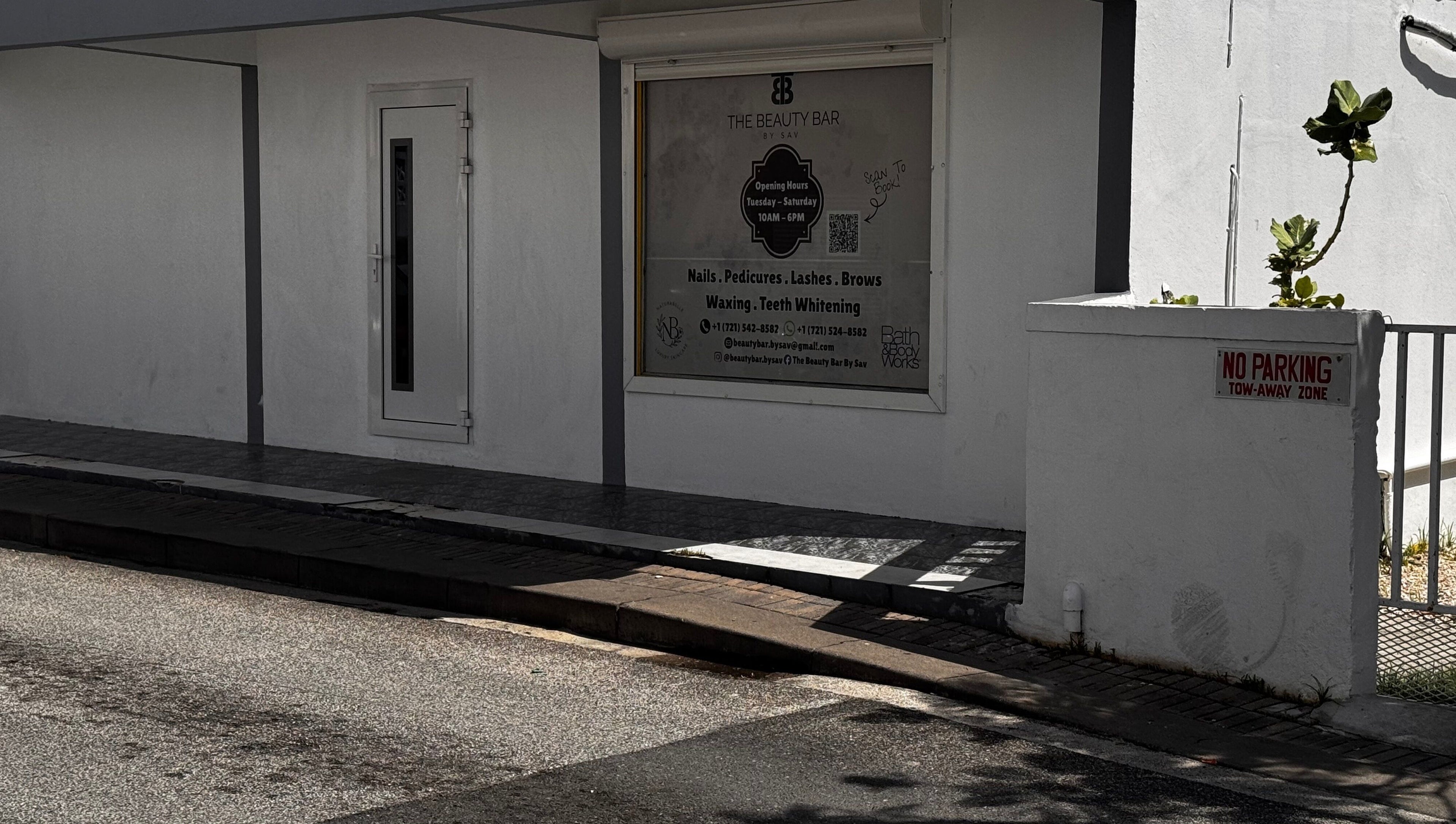 Exterior view of The Beauty Bar By Sav & Co at Philipsburg, SX, showcasing service offerings and entrance.