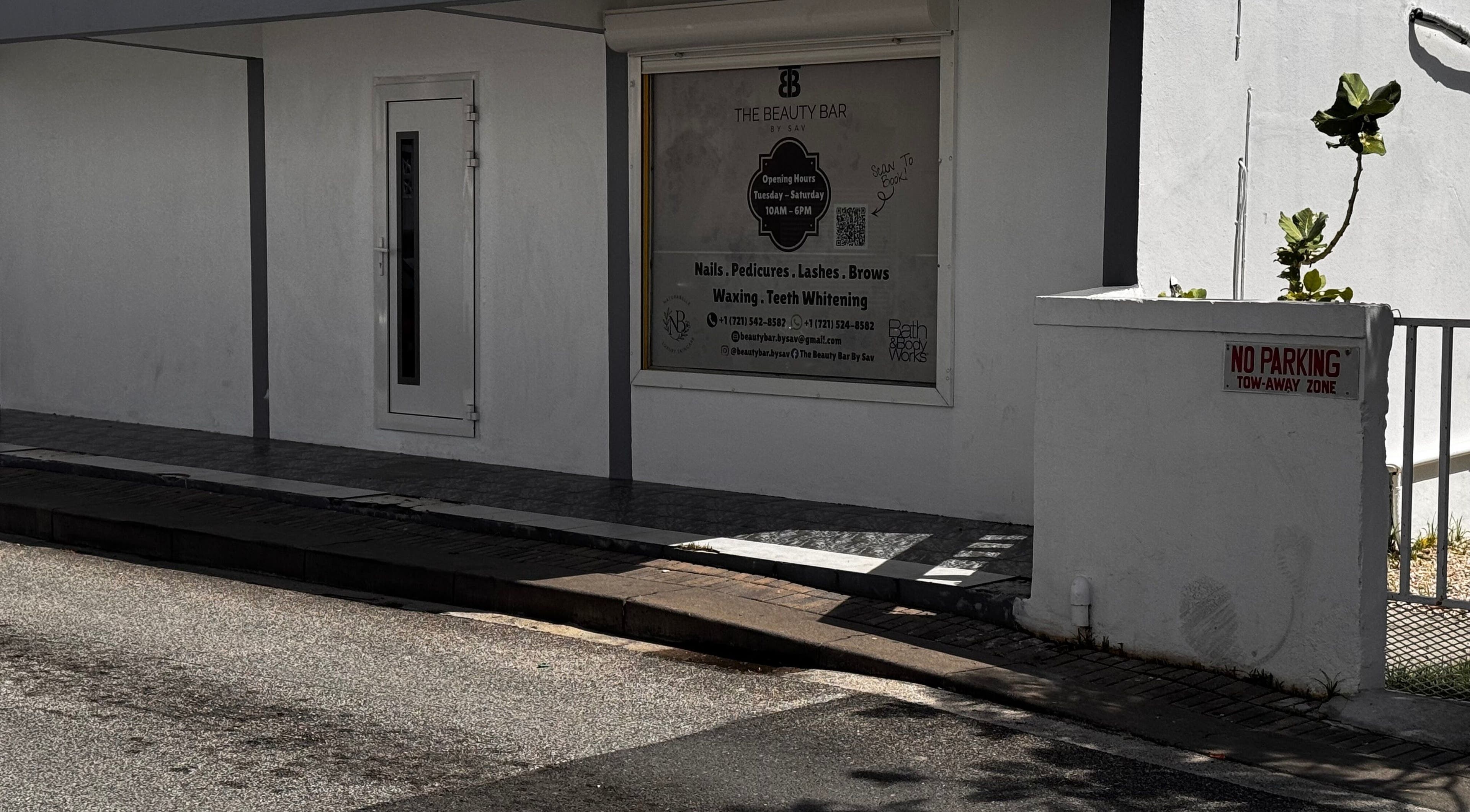 Exterior view of The Beauty Bar By Sav & Co at Philipsburg, SX, showcasing service offerings and entrance.