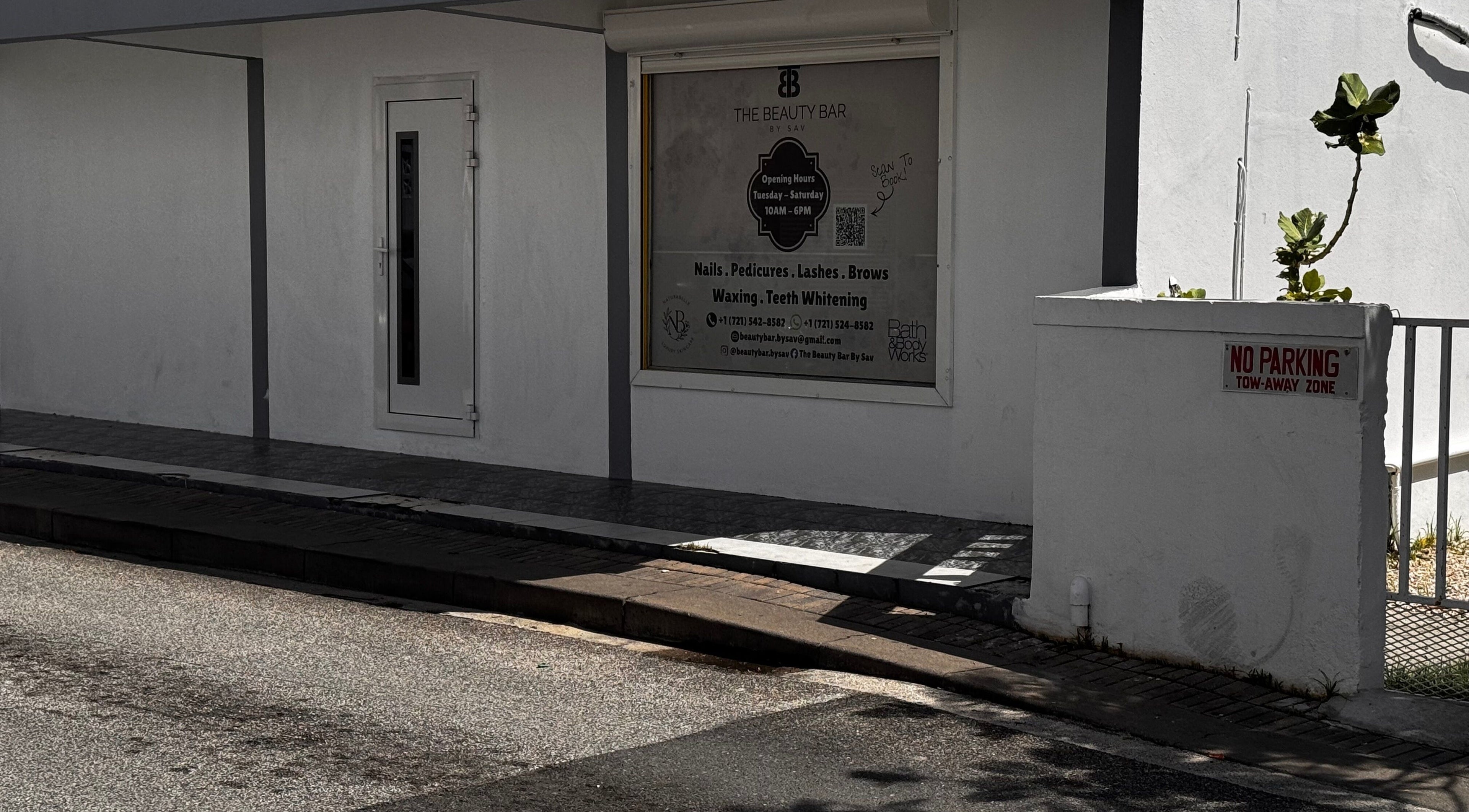 Exterior view of The Beauty Bar By Sav & Co at Philipsburg, SX, showcasing service offerings and entrance.