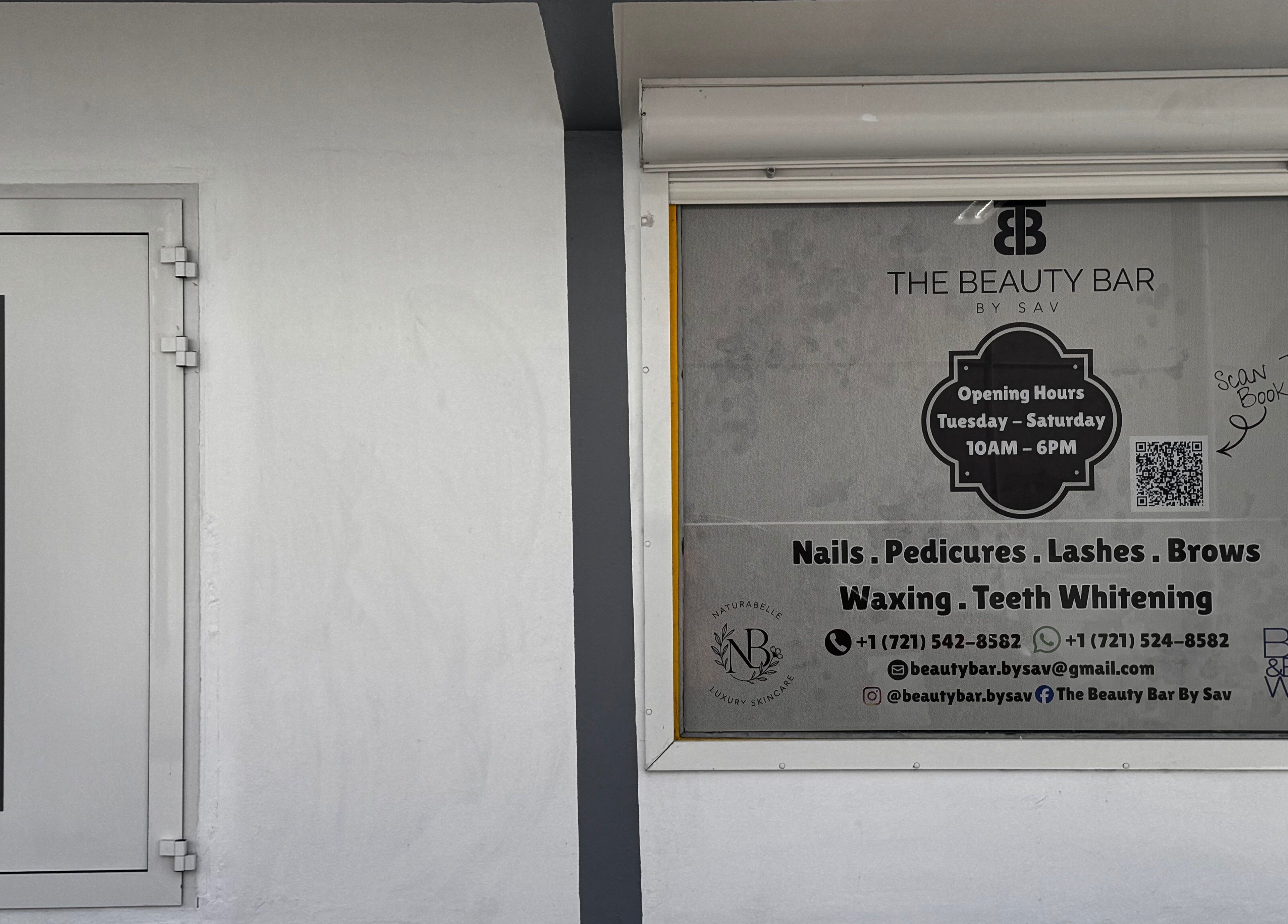 Entrance of The Beauty Bar By Sav & Co in Philipsburg, featuring services and opening hours.