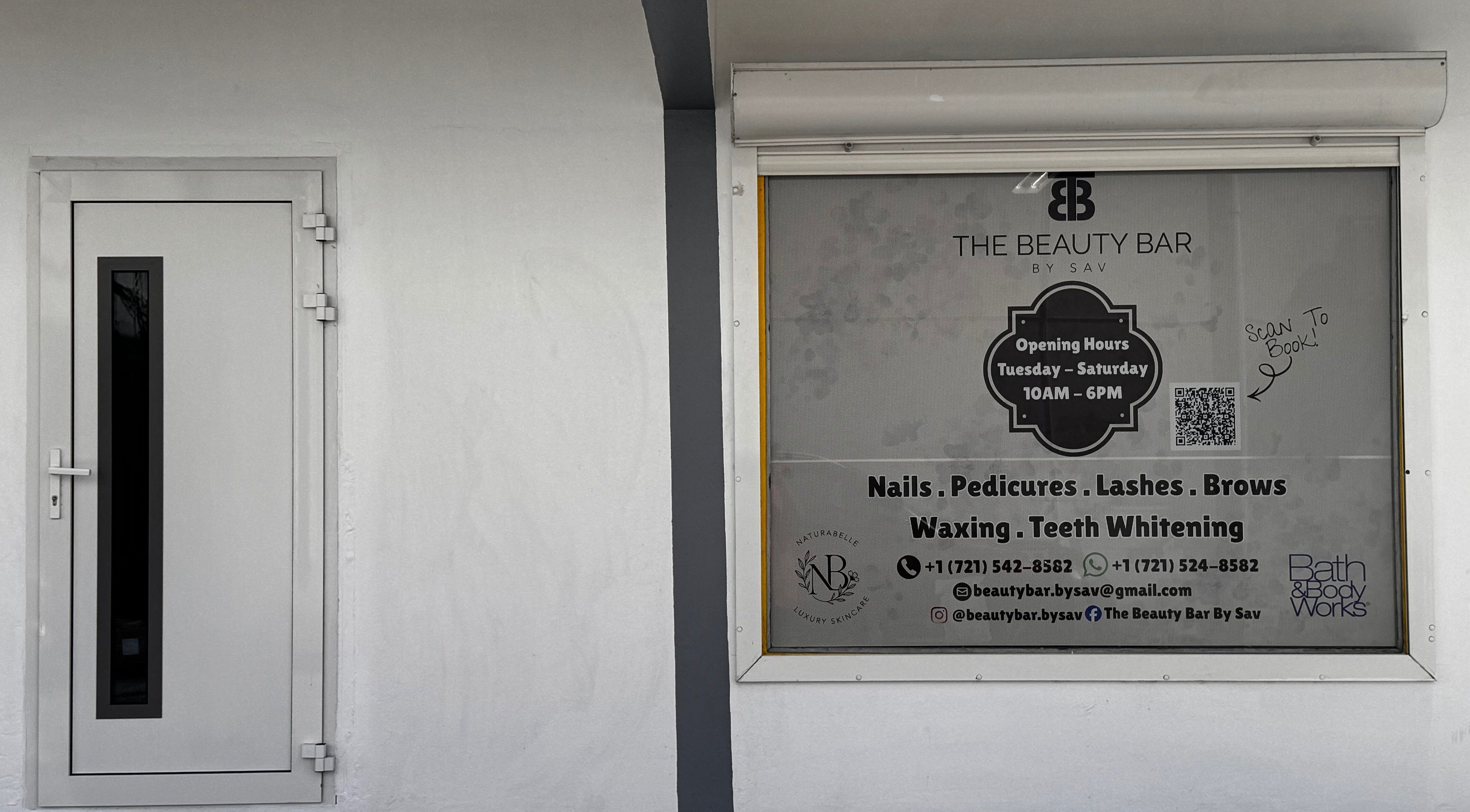 Entrance of The Beauty Bar By Sav & Co in Philipsburg, featuring services and opening hours.