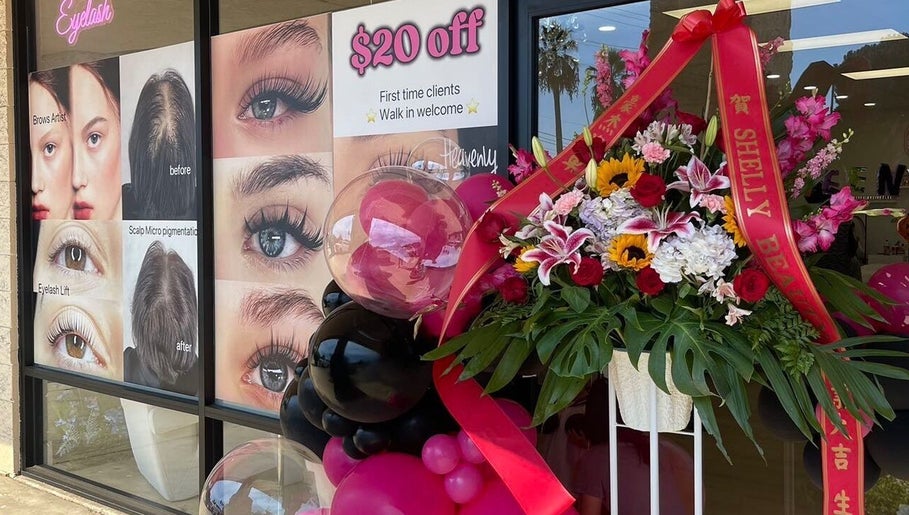 Shelly Beauty Studio entrance in Monrovia, California, with vibrant floral decor and service posters.