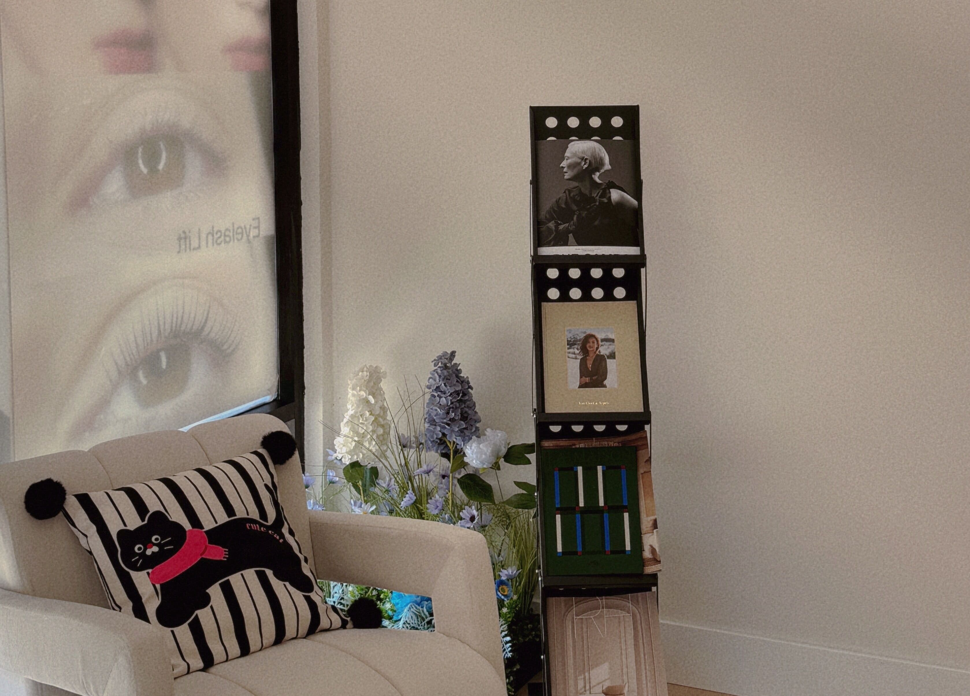 Inviting corner at Shelly Beauty Studio, Monrovia, California with a stylish chair and floral decor.