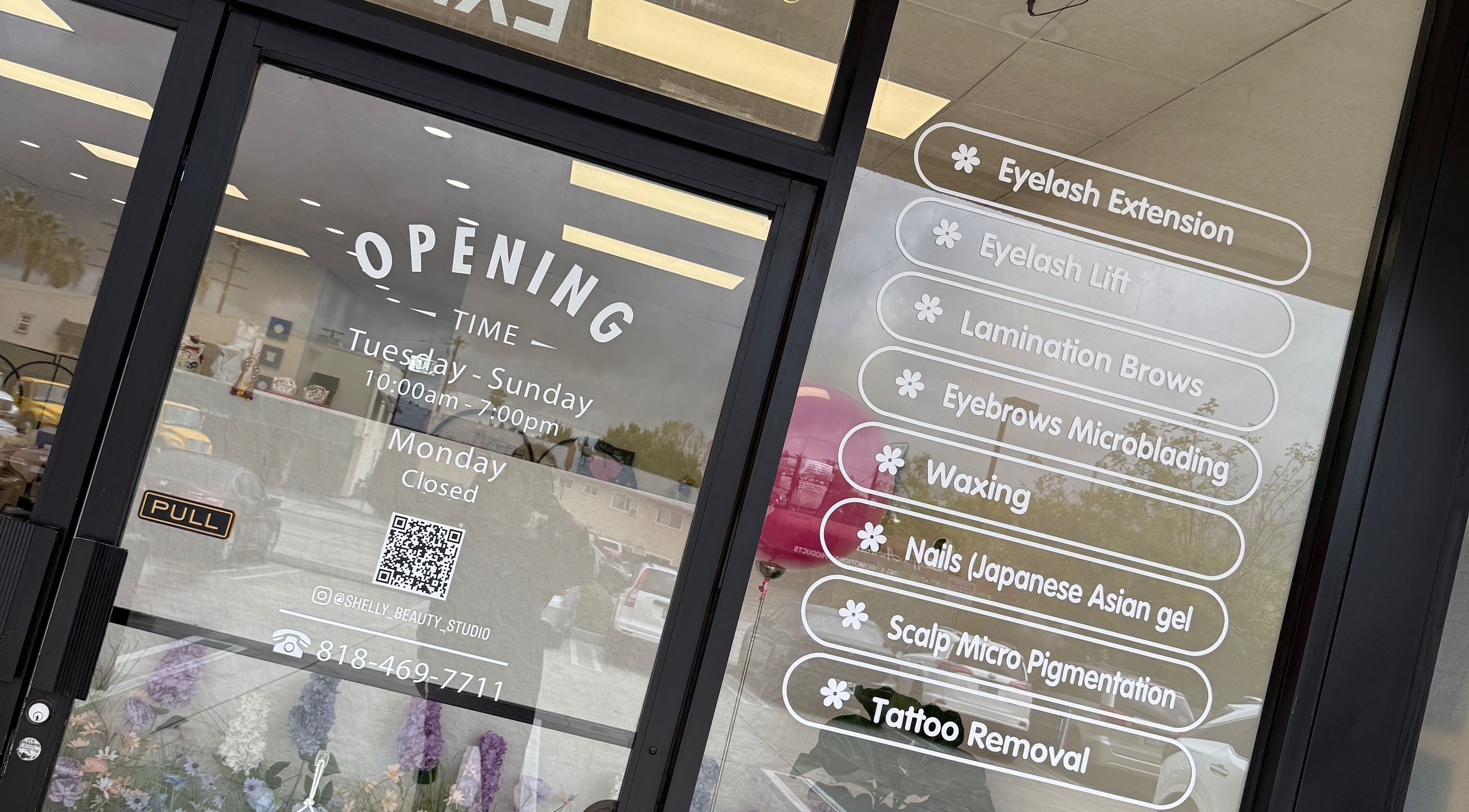 Shelly Beauty Studio entrance in Monrovia, California displaying service menu and hours.