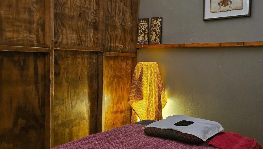 Cozy massage room at Piyawat Thai Massage Maylands, Western Australia, AU, featuring soft lighting and cultural decor.