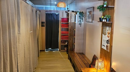 Cozy entrance of Piyawat Thai Massage Maylands, Western Australia, AU with warm lighting and plants.