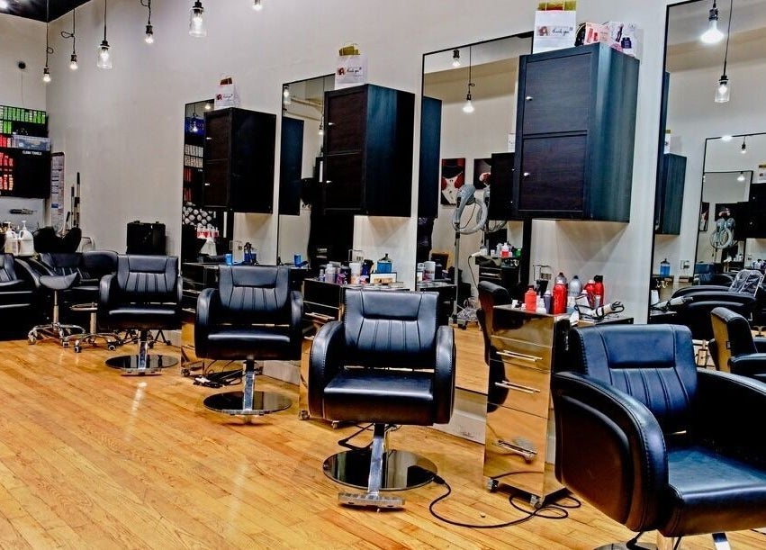 Elegant interior of Jason Mönet Hair at Stefano Oliveri Salon in New York, New York, US with sleek styling chairs.