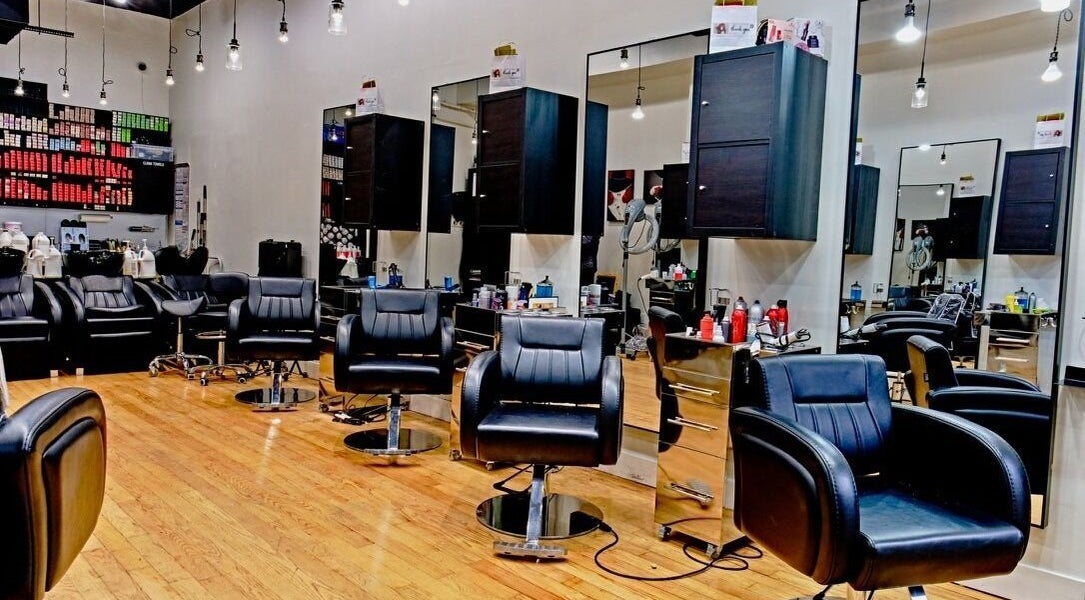 Elegant interior of Jason Mönet Hair at Stefano Oliveri Salon in New York, New York, US with sleek styling chairs.