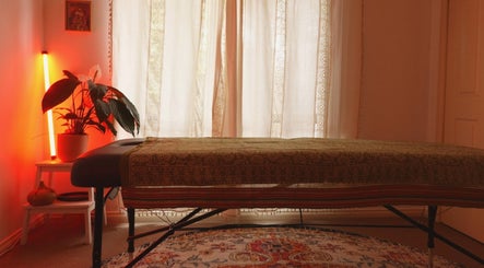 Cozy massage room at Temple Flow Massage and Bodywork - Epping, Epping, Victoria, AU with warm lighting and decor.