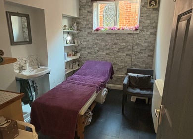 Calm treatment room with table and chair at Beauty By Willow, Weymouth, England, GB.
