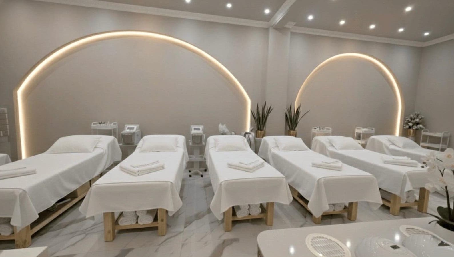 Tranquil treatment room with six spa beds at Beauty Essentials, Edinburgh, Scotland, GB.