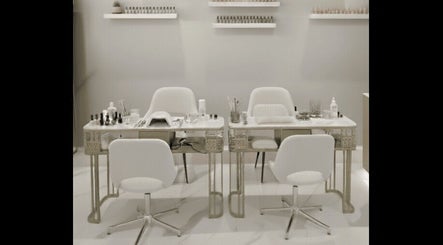 Chic nail salon setup at Beauty Essentials, Edinburgh, Scotland, GB, featuring modern white chairs and manicure tables.