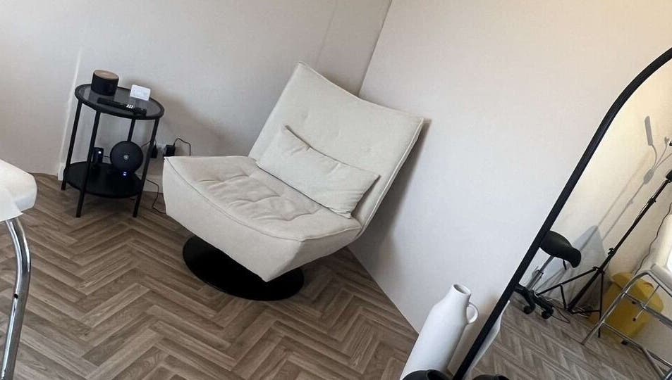 Elegant seating area at BooBeauty, Leighton Buzzard, GB featuring a plush chair and modern decor.