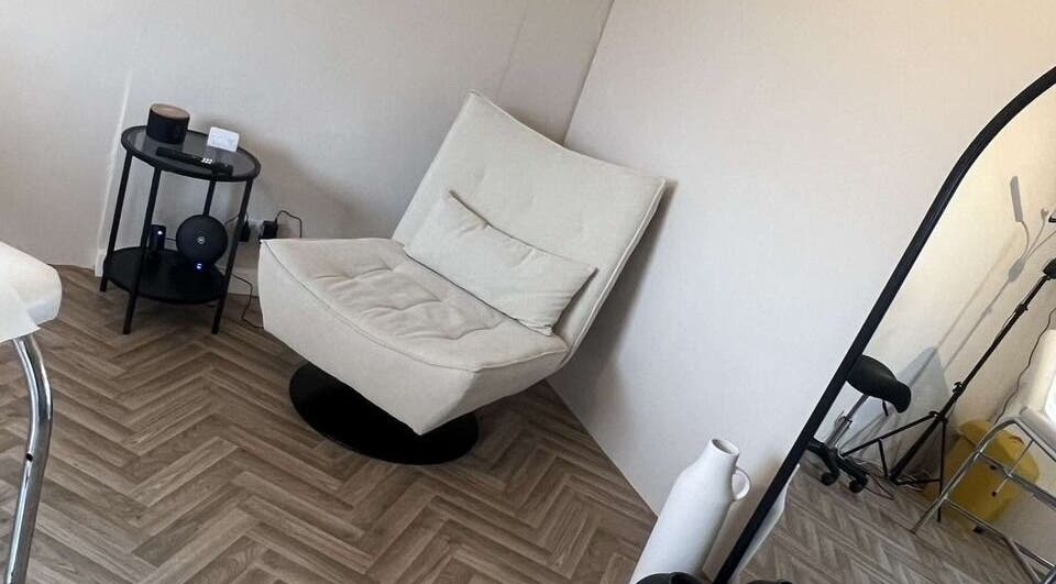 Elegant seating area at BooBeauty, Leighton Buzzard, GB featuring a plush chair and modern decor.