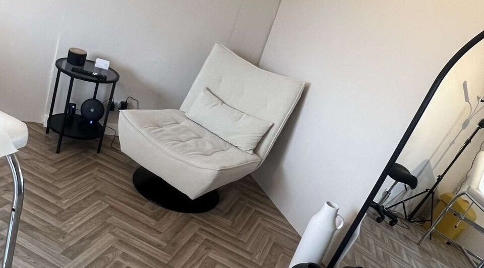 Elegant seating area at BooBeauty, Leighton Buzzard, GB featuring a plush chair and modern decor.
