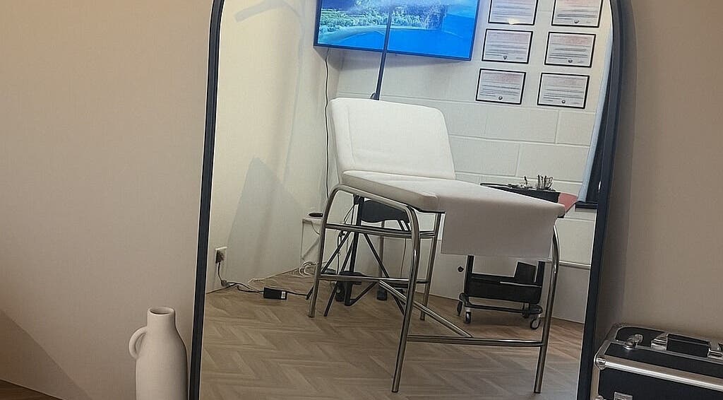 Modern treatment room at BooBeauty, Leighton Buzzard, GB with a comfortable bed and elegant decor.