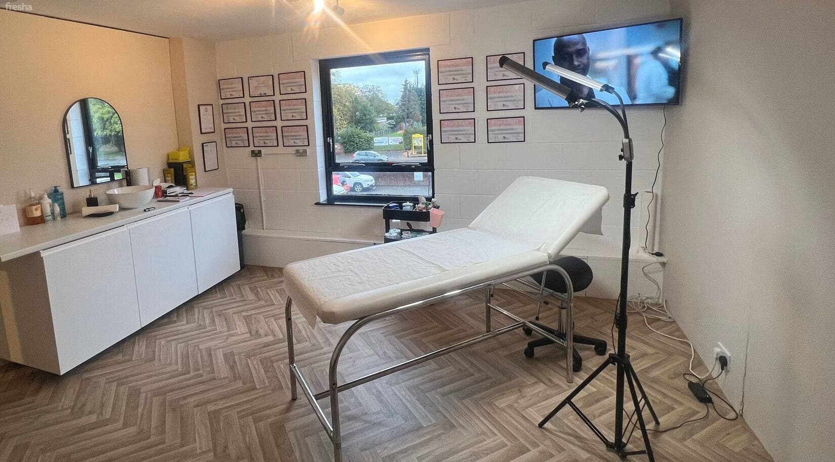 Modern treatment room at BooBeauty showcasing a spa bed and decor in Leighton Buzzard, GB.