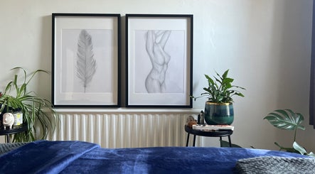 Tranquil room at Carly Whitington, London, England, GB, featuring elegant art and lush greenery.