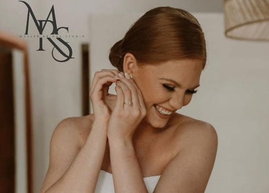 Radiant bride smiling at Mrs Müller Bridal Studio, Pretoria, Gauteng, ZA. Perfect venue for weddings.