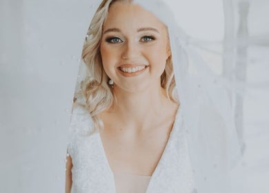 Bride glowing at Mrs Müller Bridal Studio, Pretoria, Gauteng, ZA in elegant wedding attire.