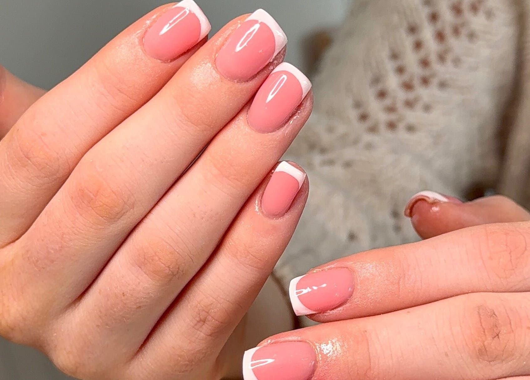 Elegant French manicure at BySorayah, Birmingham, England, GB, showcasing flawless nail design.
