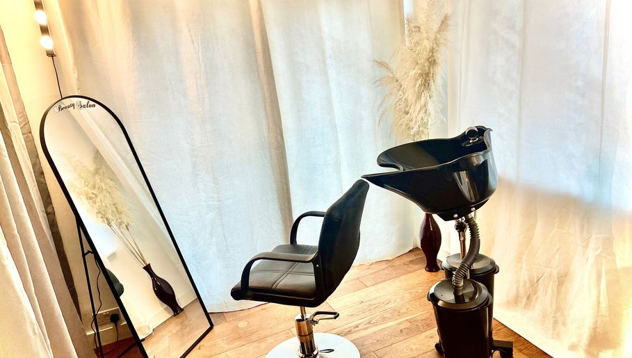Modern salon setup at Sleek Hair By C, Poole, England, GB featuring sleek styling chair and wash basin.