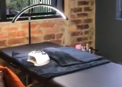 Cozy treatment room at The Sonho Beauty Studio in Centurion, Gauteng, ZA, featuring a massage bed and soft lighting.