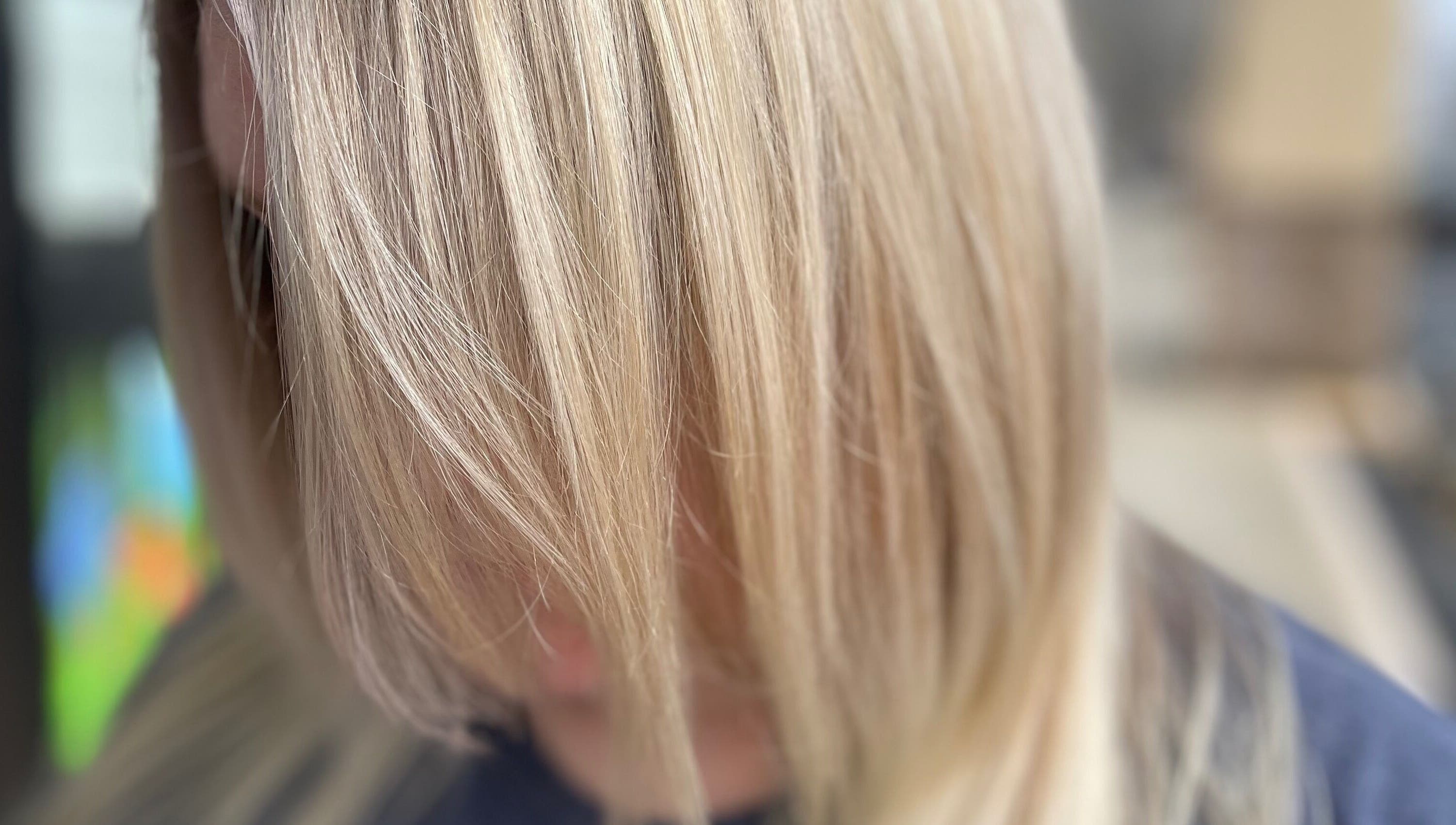 Close-up of silky blonde hair at Hair Shack, Bourbon, Missouri, US, showcasing a vibrant and healthy shine.