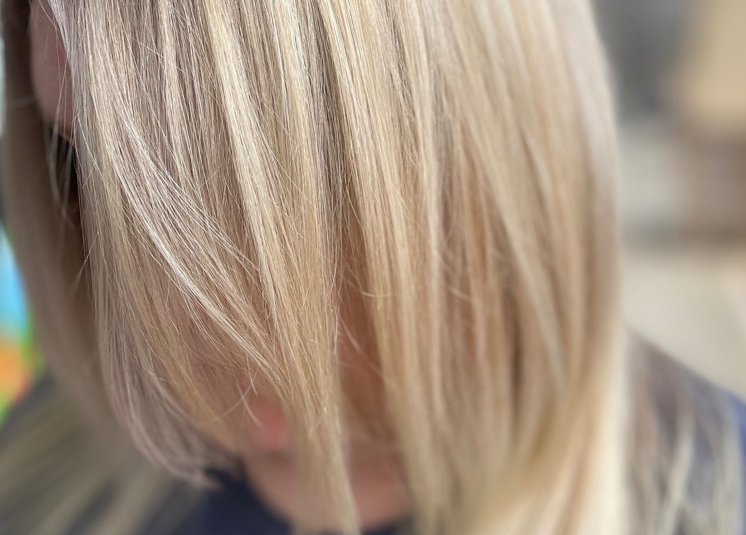 Close-up of silky blonde hair at Hair Shack, Bourbon, Missouri, US, showcasing a vibrant and healthy shine.