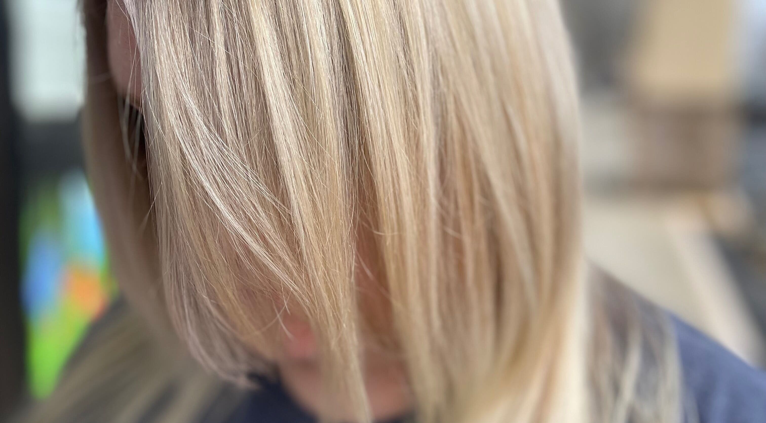 Close-up of silky blonde hair at Hair Shack, Bourbon, Missouri, US, showcasing a vibrant and healthy shine.