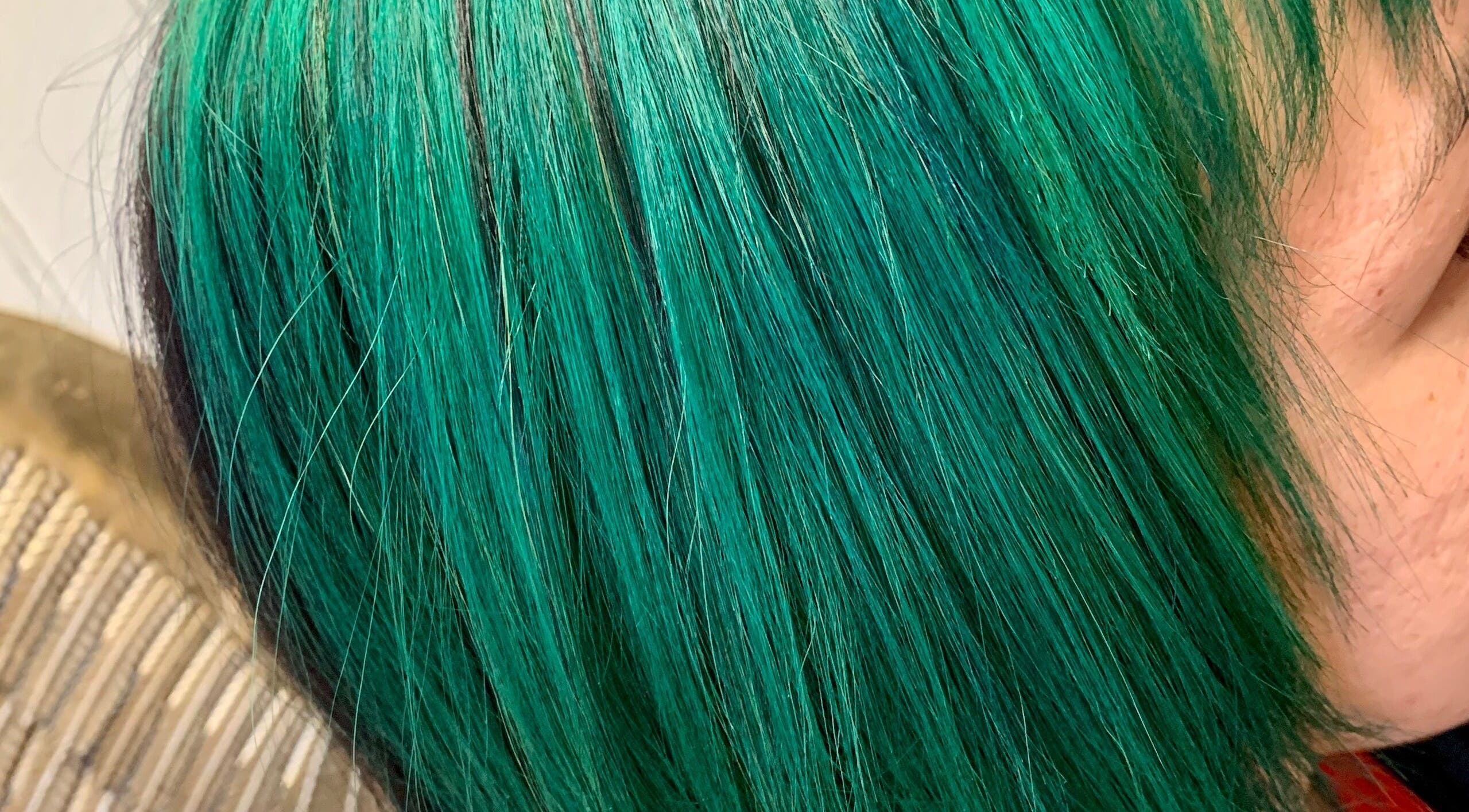 Vibrant emerald hair styled at Hair Shack, Bourbon, Missouri, US.