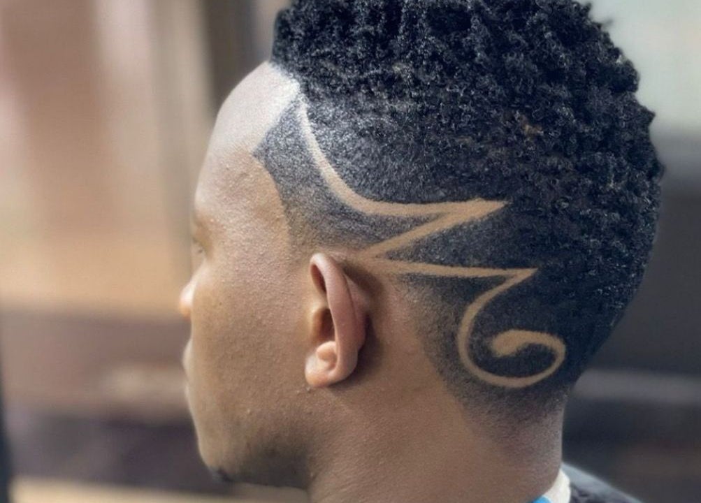 Intricate hair design at Gentlemen's Lounge, Nairobi, KE, showcasing expert styling and grooming.