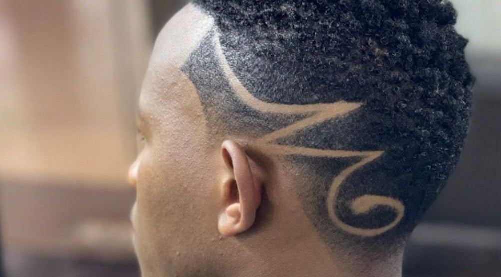 Intricate hair design at Gentlemen's Lounge, Nairobi, KE, showcasing expert styling and grooming.
