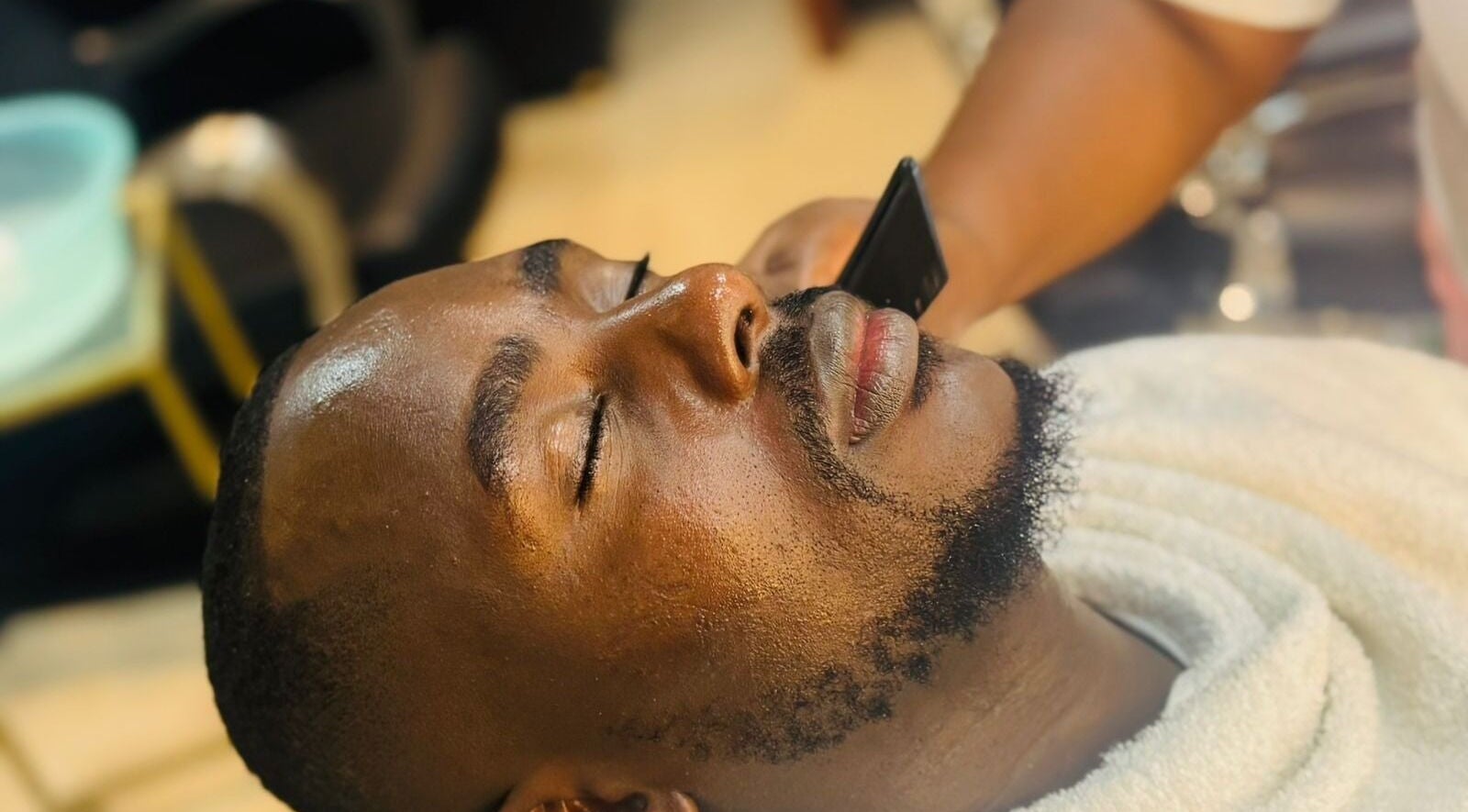 Gentlemen's Lounge in Nairobi, KE offers a calming shave experience with expert care.