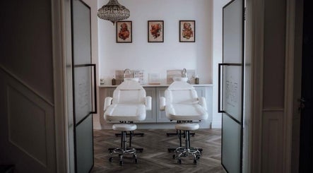 Elegant treatment room at Beauty ink by R.D, Belfast, Northern Ireland, GB, with two plush chairs.