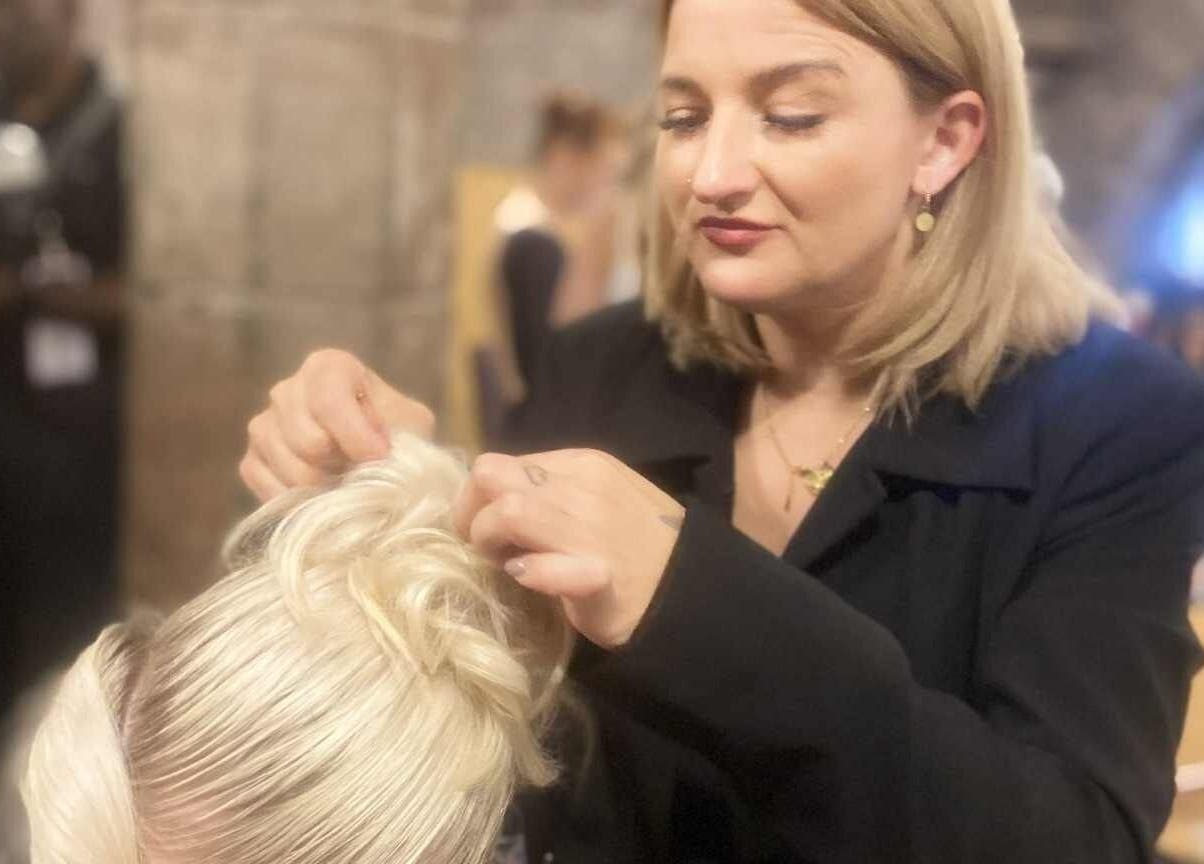 Justyna Gierej perfecting an elegant hairstyle at Royton, Lancashire, GB beauty venue.