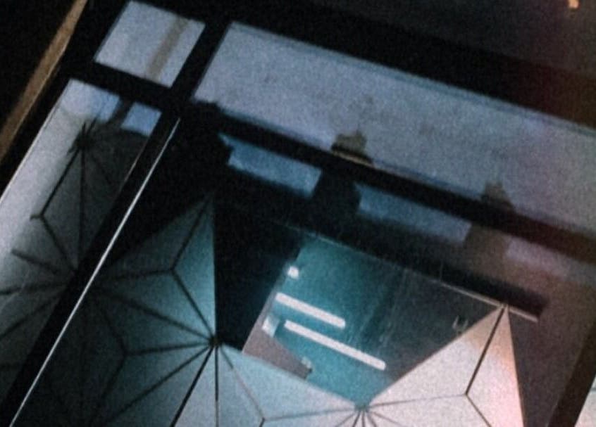 Elegant geometric window reflection at Justyna Gierej, Royton, Lancashire, GB specializing in beauty and wellness.