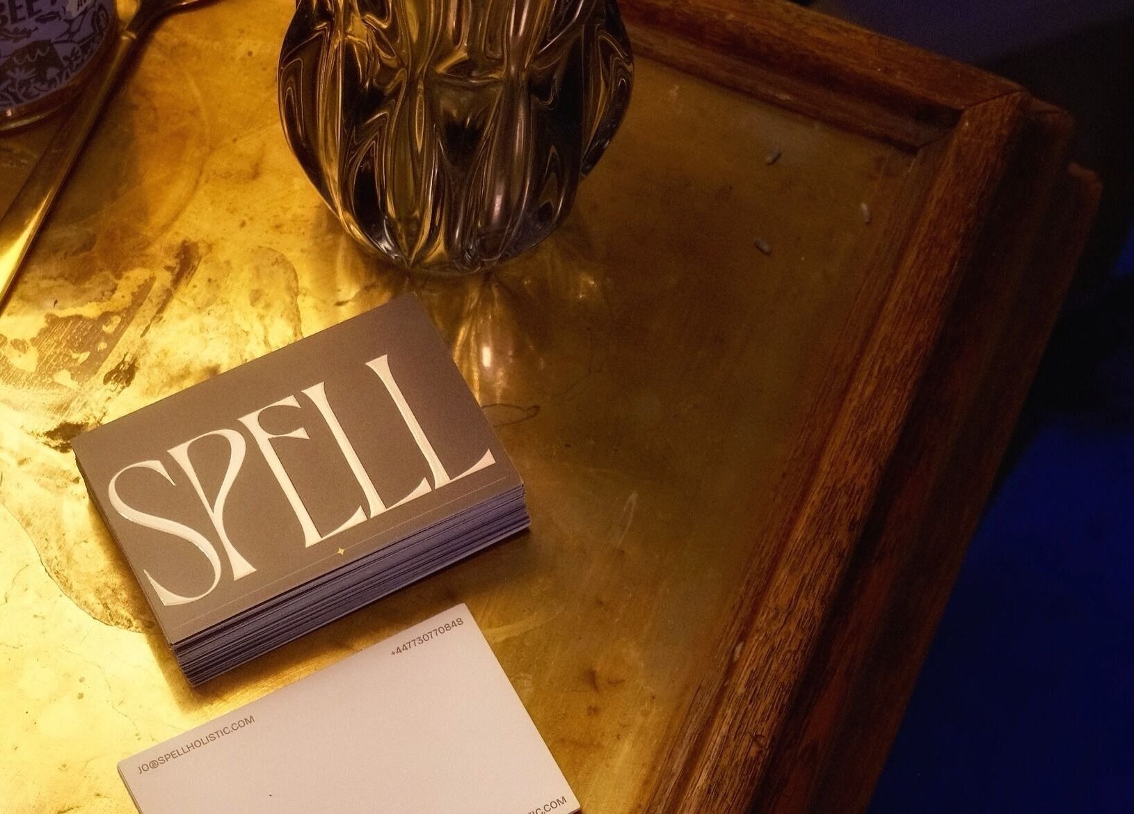 Elegant corner at Spell Holistic, Saint Leonards, England, with business cards and decor.