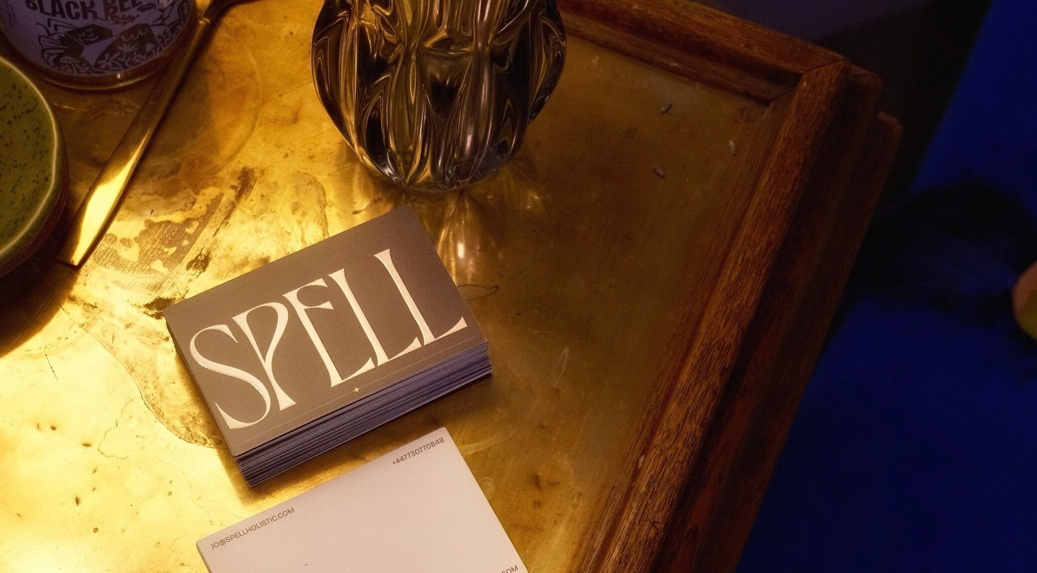 Elegant corner at Spell Holistic, Saint Leonards, England, with business cards and decor.